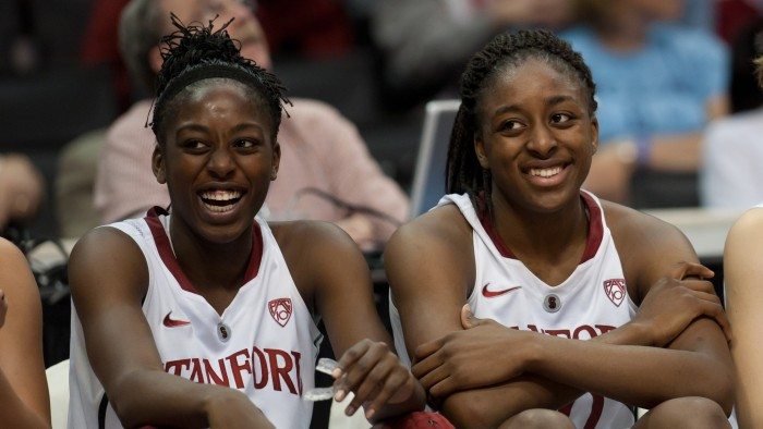 LOS ANGELES, CA - March 11, 2011: Stanford's Chiney Ogwumike (l) and Nnemkadi Ogwumike enjoy late game action during the semi-final game of the 2011 Pac-10 Tournament game against the Arizona Wildcats at Staples Center. Stanford won, 100-71. The Ogwumike sisters combined for 53 points and 23 rebounds.